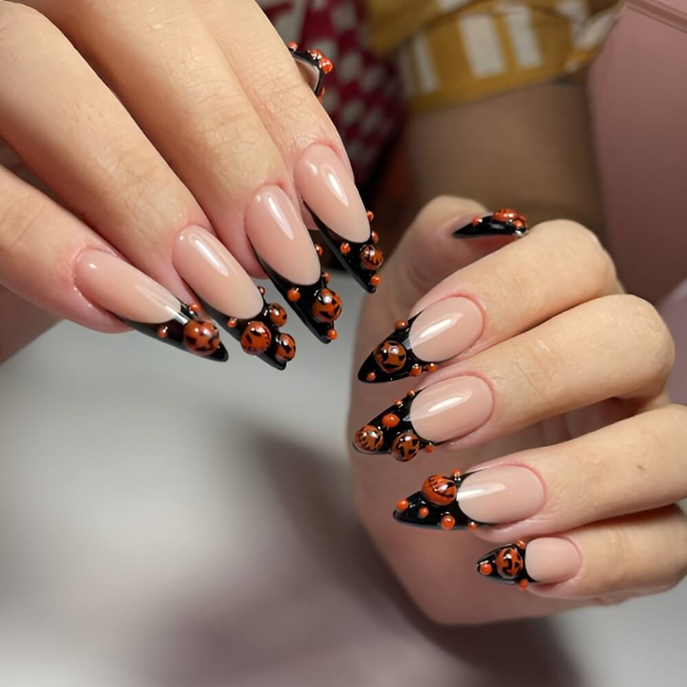 Black French Halloween nails with 3D pumpkin – bold and textured spooky nail art.