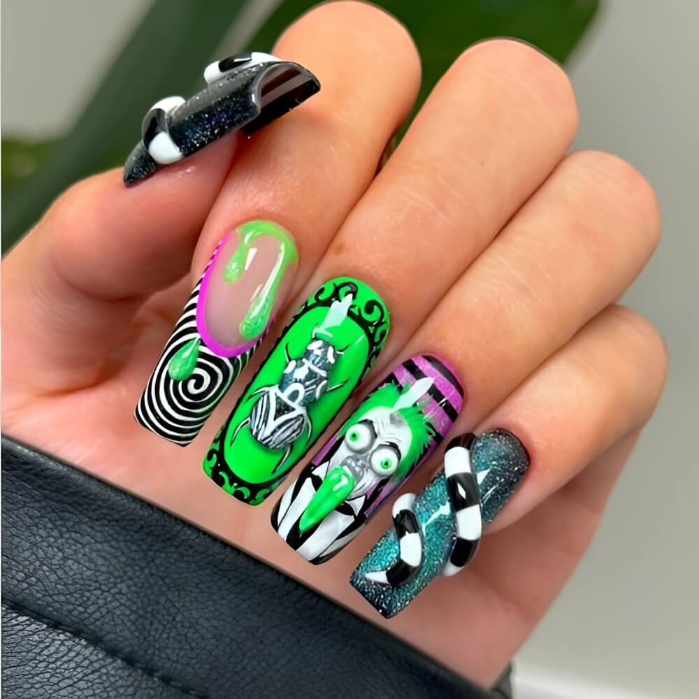 Halloween nails inspired by Beetlejuice – striped and spooky nail art for fans of the classic film. Beautiful Halloween nails ideas