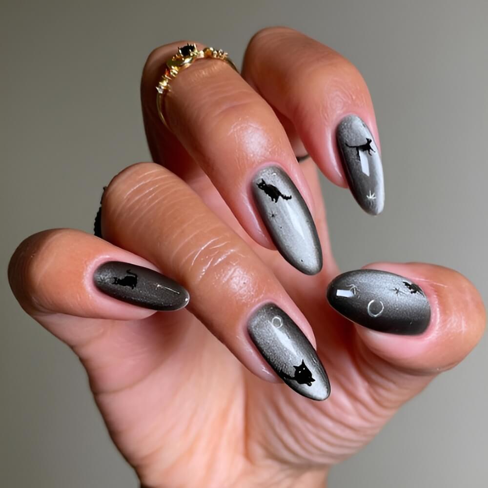 Halloween nails featuring black cats and moon details – perfect spooky cat nail art. Beautiful Halloween nails ideas