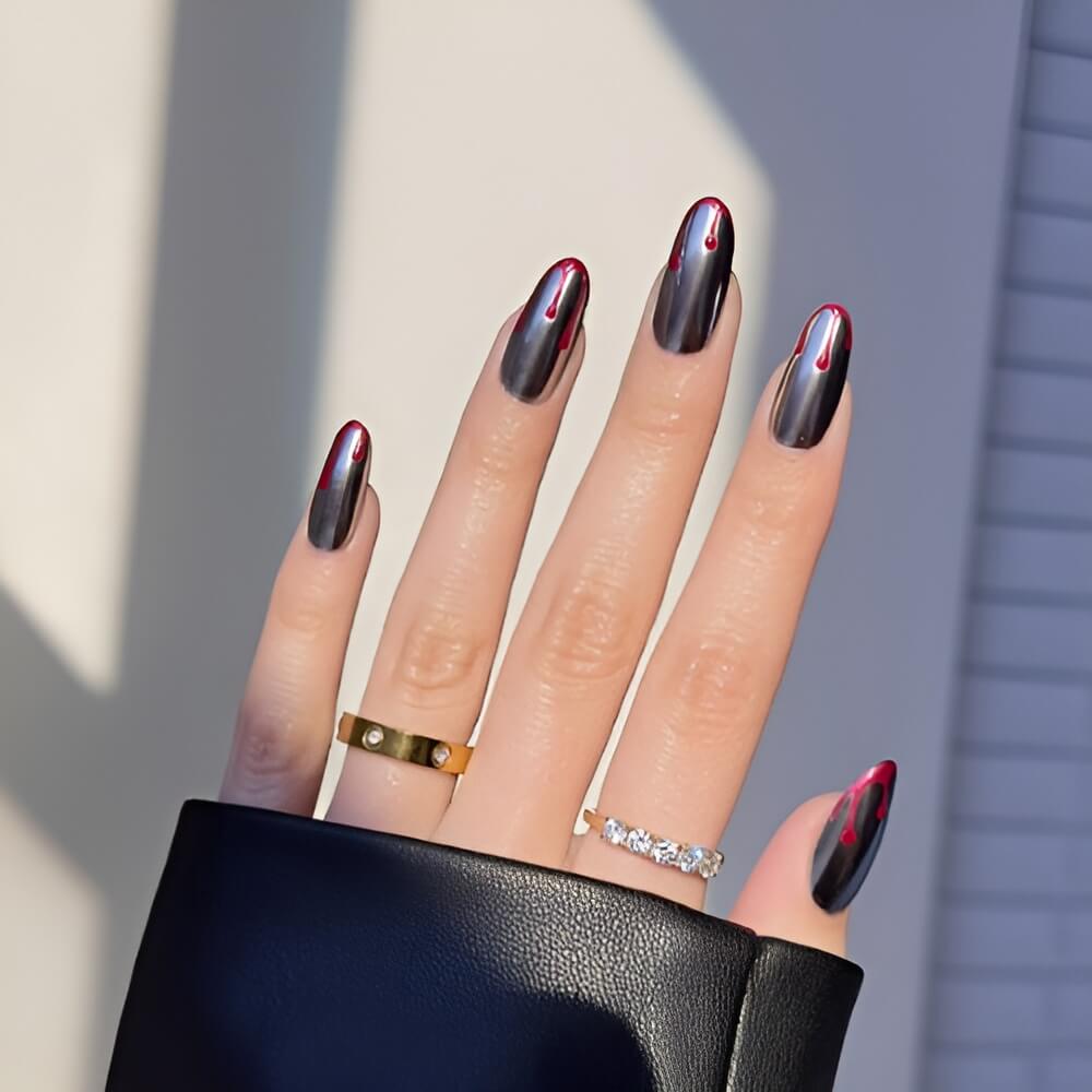 Edgy black chrome French tip nails with dramatic blood drip design for Halloween. Beautiful Halloween nails ideas