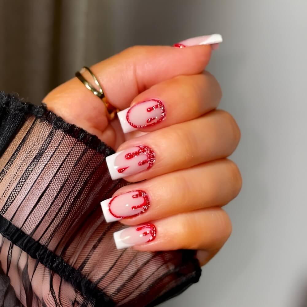 French Halloween nails with bloody glitter tips – scary glam nail idea for Halloween night. Beautiful Halloween nails ideas