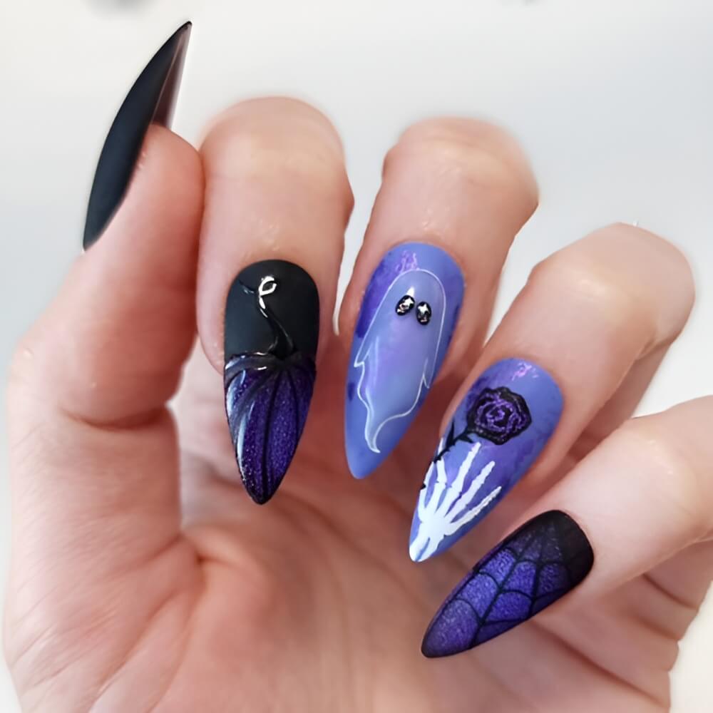 Blue Halloween nails with ghost and skeleton art – unique and eye-catching spooky manicure. Beautiful Halloween nails ideas