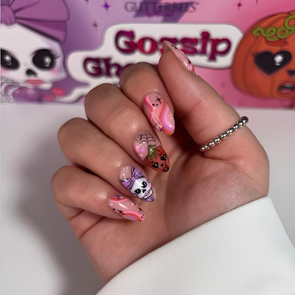 Cute Halloween nails with skeleton and pumpkin wearing a bow – fun and festive nail art. Beautiful Halloween nails ideas