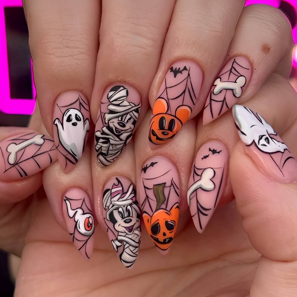 Disney-inspired Halloween nails with spiderweb accents – magical spooky nail art idea. Beautiful Halloween nails ideas