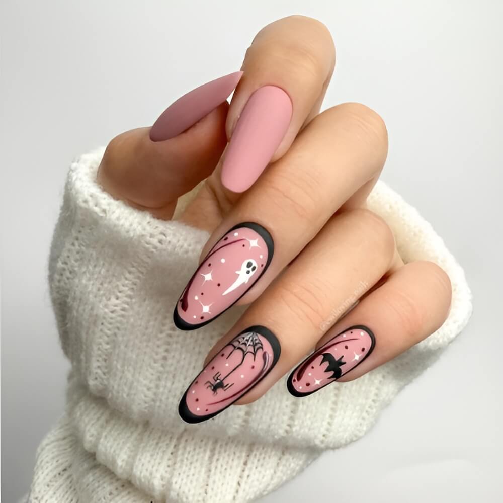 Classic Halloween nail art with spooky ghosts and tiny black spiders Beautiful Halloween nails ideas
