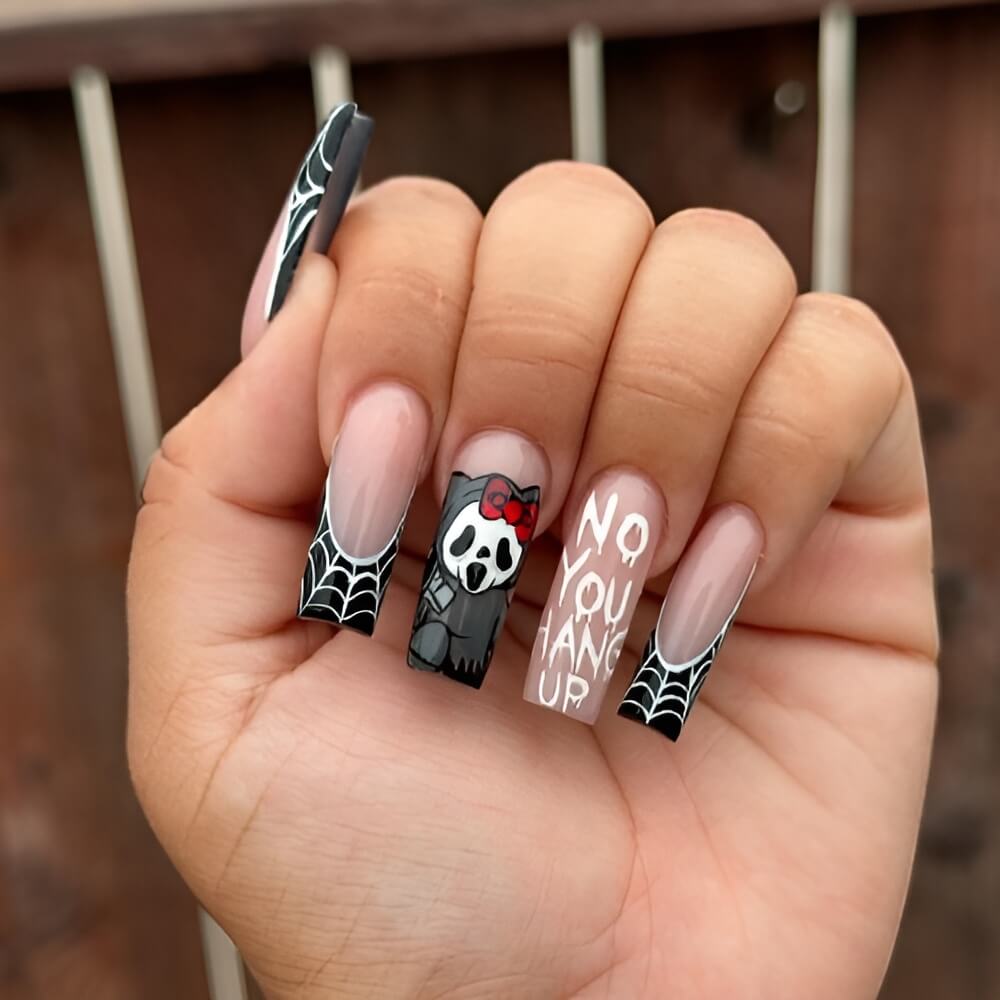 Hello Kitty meets Scream in a unique Halloween nail design Beautiful Halloween nails ideas