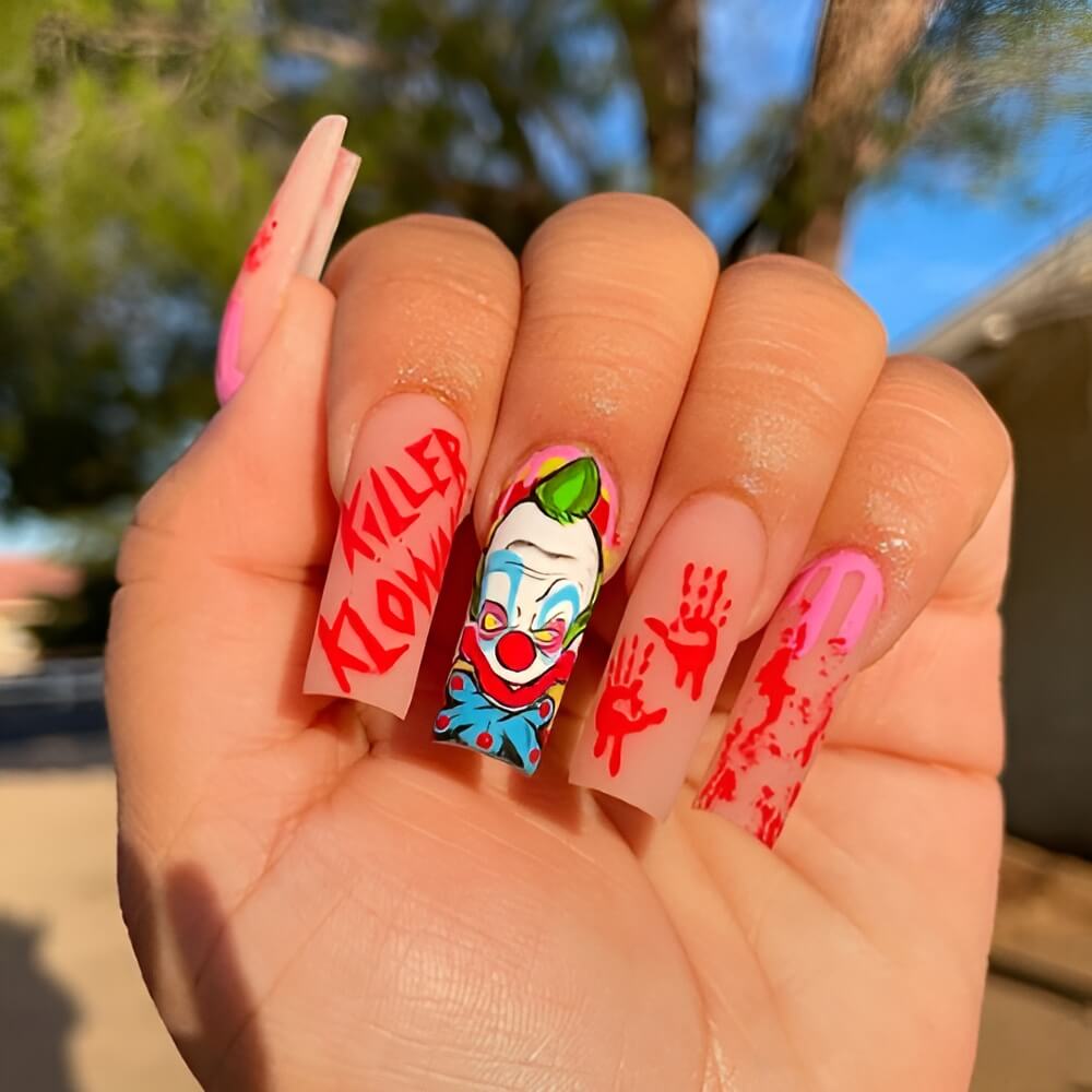 Terrifying killer clown-inspired Halloween nail design. Beautiful Halloween nails ideas