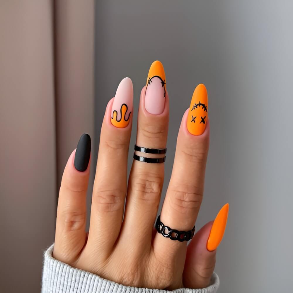 Classic orange and black Halloween nails – traditional spooky color combo in cute nail art.