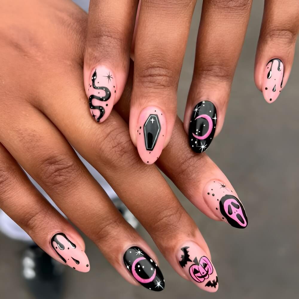 Witchy pink and black Halloween nails – magical nail design for a stylish spooky look. Beautiful Halloween nails ideas