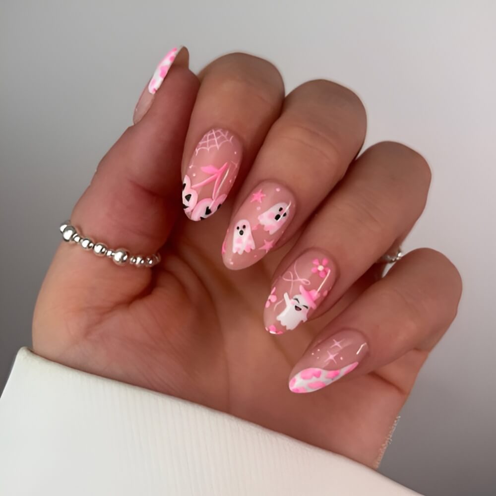 Pink Halloween nails with adorable spooky accents – cute Halloween nail idea for girly vibes.