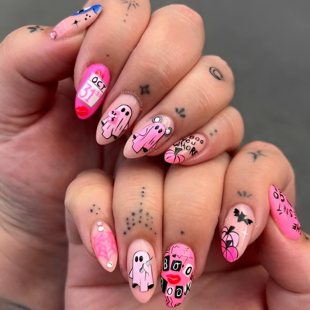 Pink Halloween nails with ghosts and “Mean Girls” flair – pretty and fun Halloween mani. Beautiful Halloween nails ideas