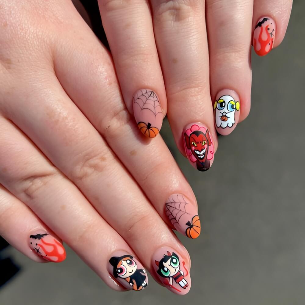 Powerpuff Girls Halloween nails with spooky cartoon art and vibrant colors – cute and fun Halloween nail design. Beautiful Halloween nails ideas