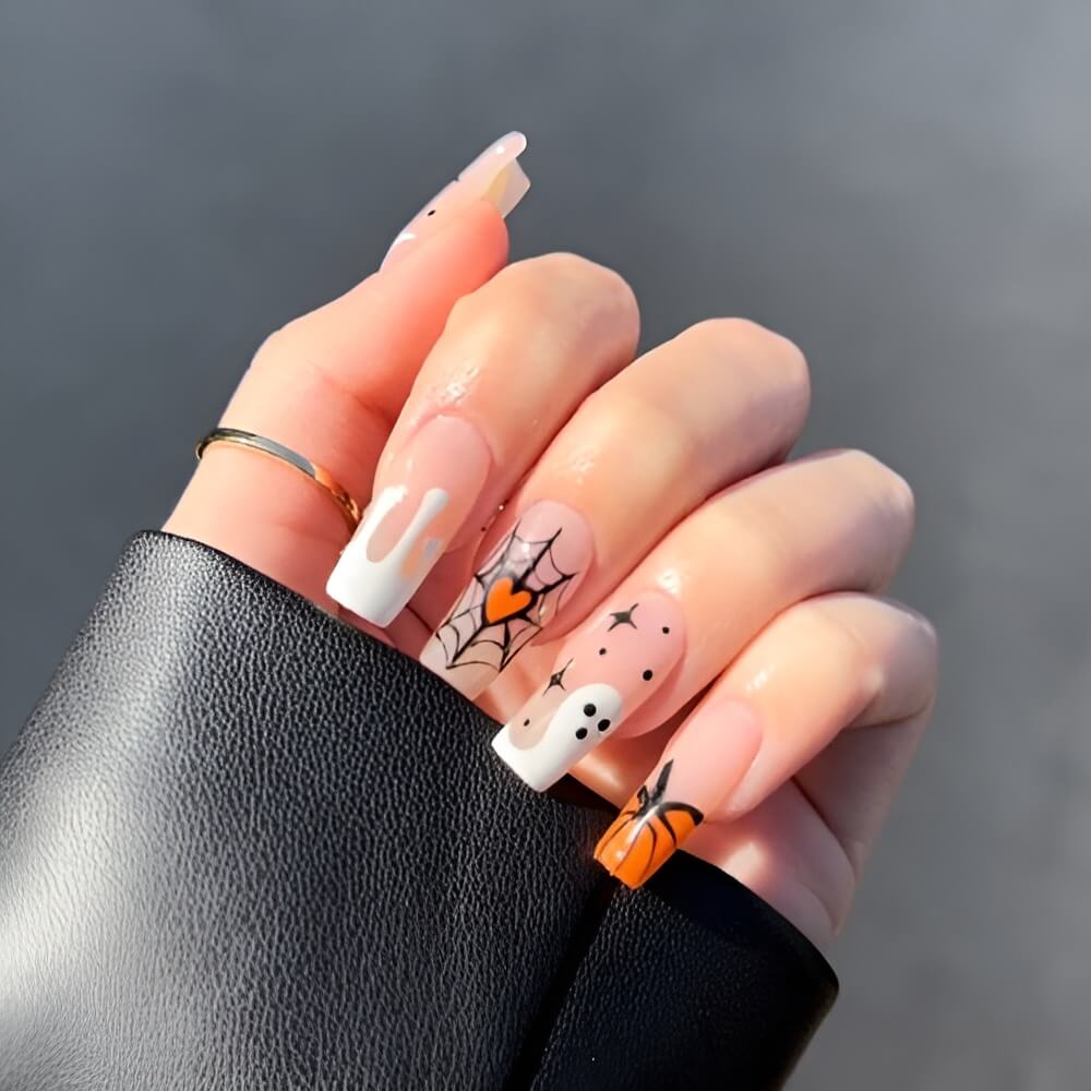Festive Halloween nails with cute pumpkins and ghost art. Beautiful Halloween nails ideas