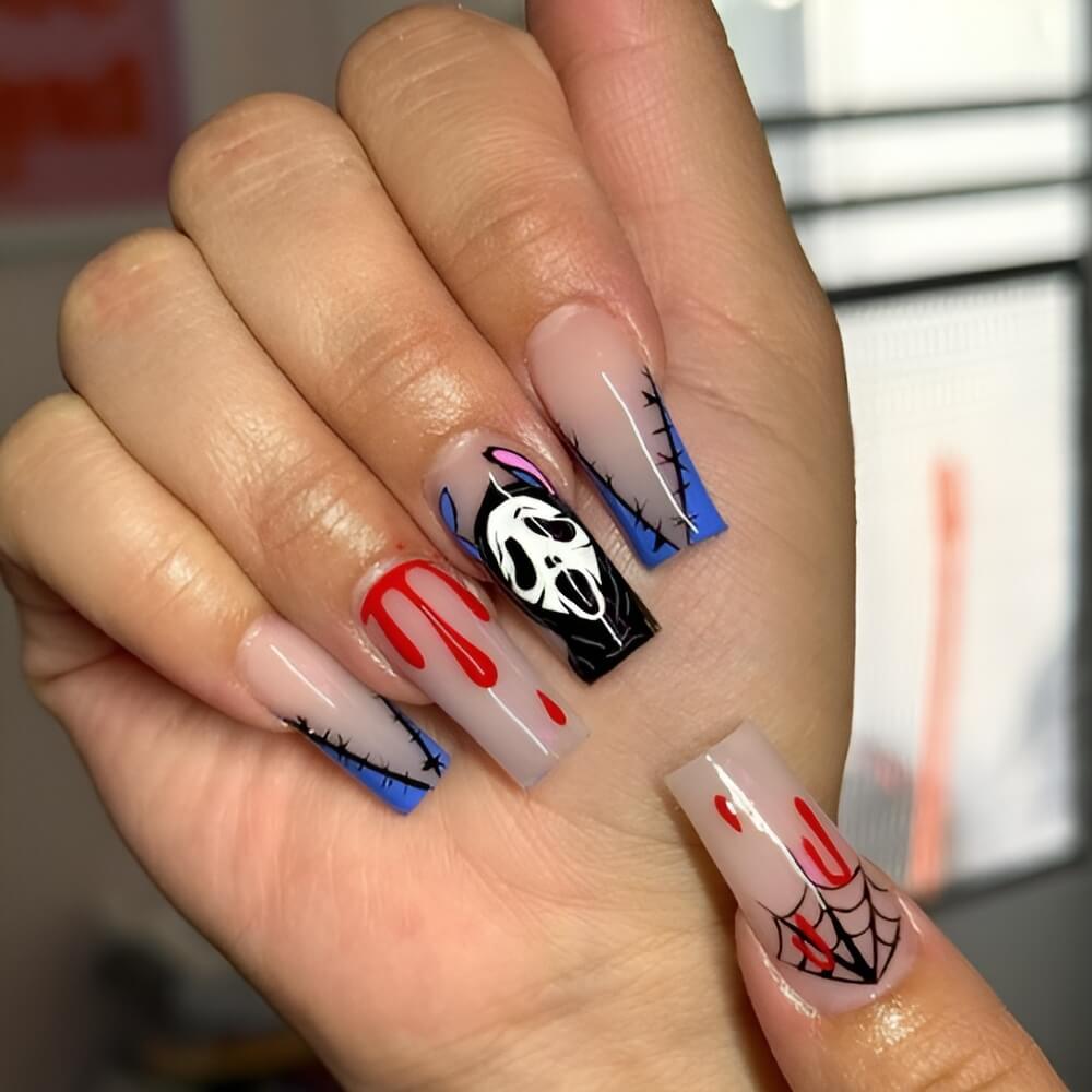 Horror twist on Stitch with Scream face Halloween nail art Beautiful Halloween nails ideas