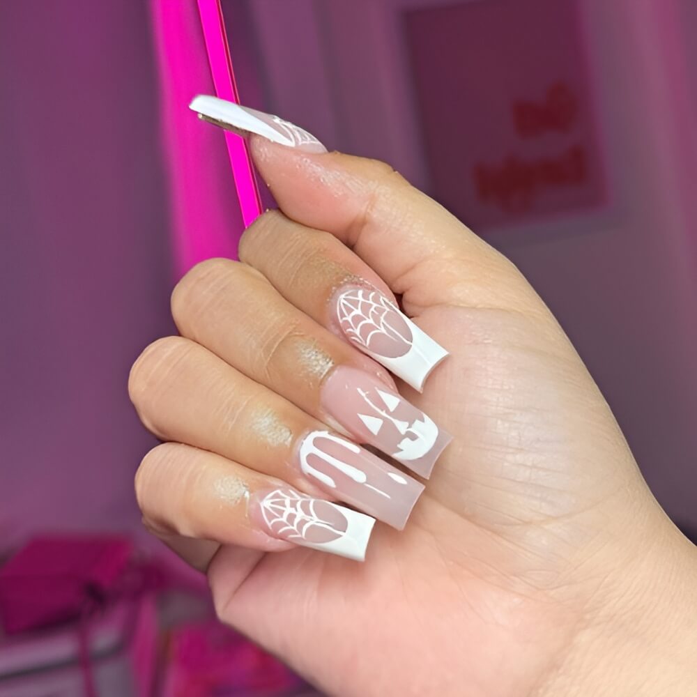 Chic white Halloween nails with minimalist ghost and spooky details