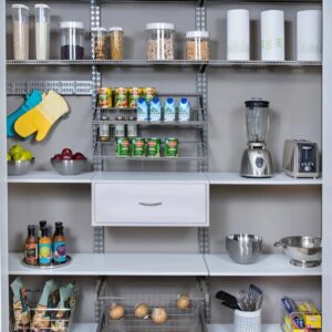 Adjustable shelving used to create vertical storage in a small kitchen pantry. Small pantry organization