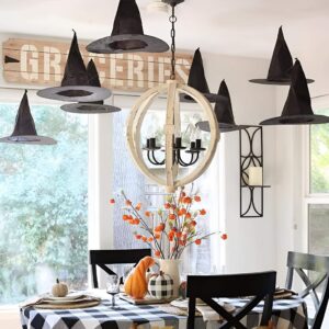 Ceiling-mounted floating witch hats with string for magical Halloween interior decoration. Halloween Decor