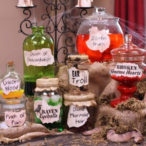 Mason jars filled with fake eyeballs and colored water for creepy Halloween specimen decor