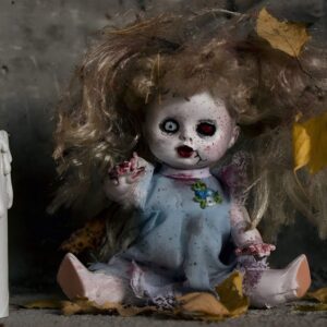 Vintage porcelain dolls with cracked faces and spooky details for creepy Halloween shelf decor