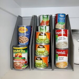 Magazine holder used in small pantry to organize foil and snack pouches. Small pantry organization