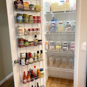 Over-the-door storage organizer with spices and snacks in a small pantry. Small pantry organization. Small pantry organization