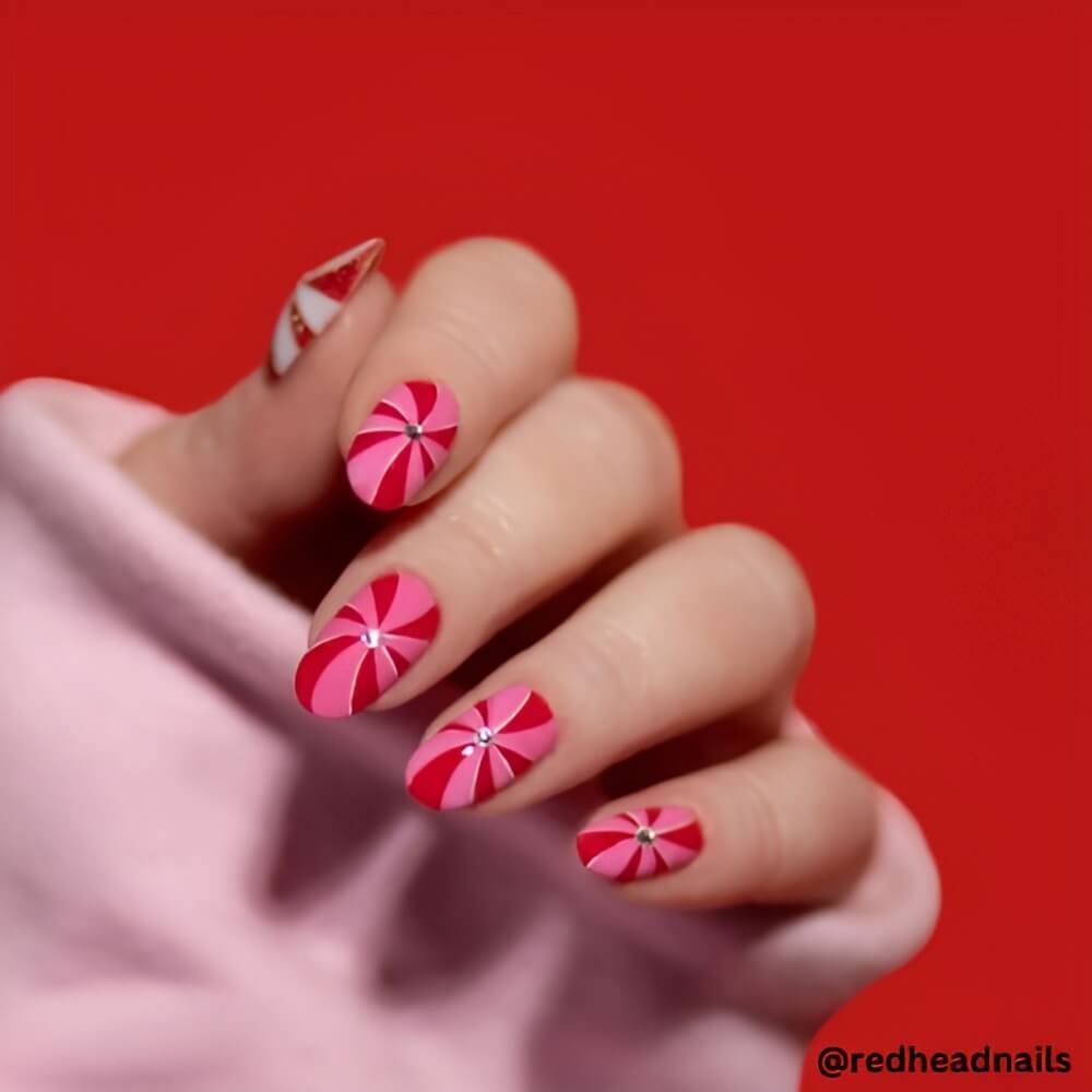 pink-and-red-christmas-candy-cone-nails.jpg