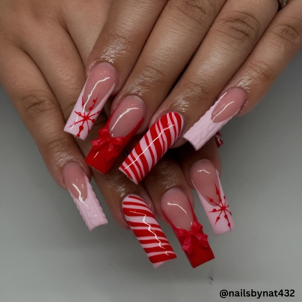 red-pink-peppermint-swirl-christmas-nails.jpg