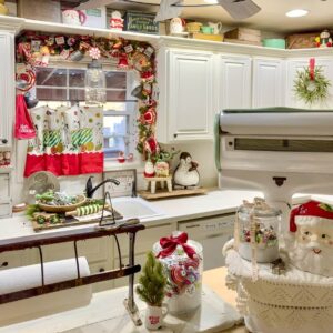 Holiday café curtains with Christmas patterns adding charm to a cozy holiday kitchen.
