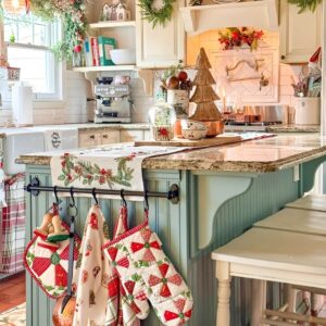 Holiday kitchen decor with Christmas dish towels and oven mitts adding pops of seasonal color. Christmas Kitchen Decoration