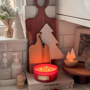 Christmas candles and seasonal scents creating a warm and inviting holiday kitchen atmosphere.