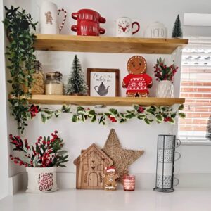 Styled open kitchen shelves with Christmas decor, greenery, and holiday accents. Christmas Kitchen Decoration