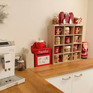 Christmas mug display on a holiday coffee bar with cocoa jars and festive accents. Christmas Kitchen Decoration
