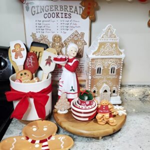 Holiday kitchen decor featuring festive cooking tools in red and green Christmas colors. Christmas Kitchen Decoration