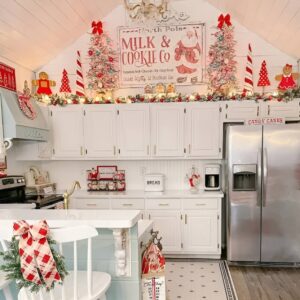 Framed Christmas prints on kitchen walls for simple and stylish holiday decor.