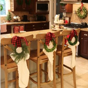 Mini Christmas stockings hanging in the kitchen for a playful and festive holiday look.