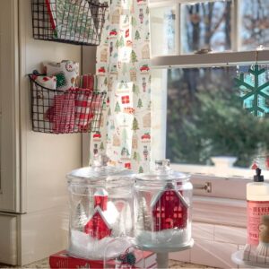 Faux snow-dusted branches in jars for a winter wonderland Christmas kitchen look.