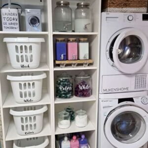 Glass jar filled with colorful laundry pods displayed on an open laundry room shelf. laundry room organization