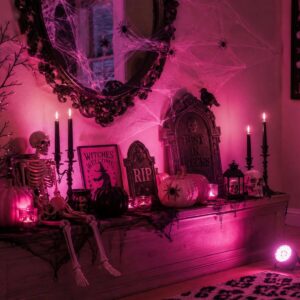 Halloween decorations illuminated with spooky pink lighting