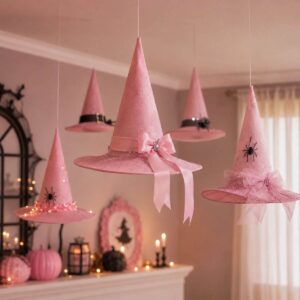 Pastel witch hats hanging from the ceiling as spooky decorations