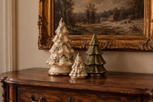 Small ceramic Christmas trees displayed on a shelf, perfect for minimalist Christmas decor ideas.