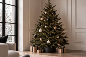 Christmas tree decorated with simple baubles and wooden ornaments, showing minimalist Christmas decor ideas.