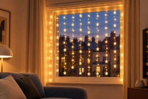 Warm white Christmas lights decorating a window in a cozy living room.